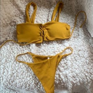 Adorable string biking with tie up top!